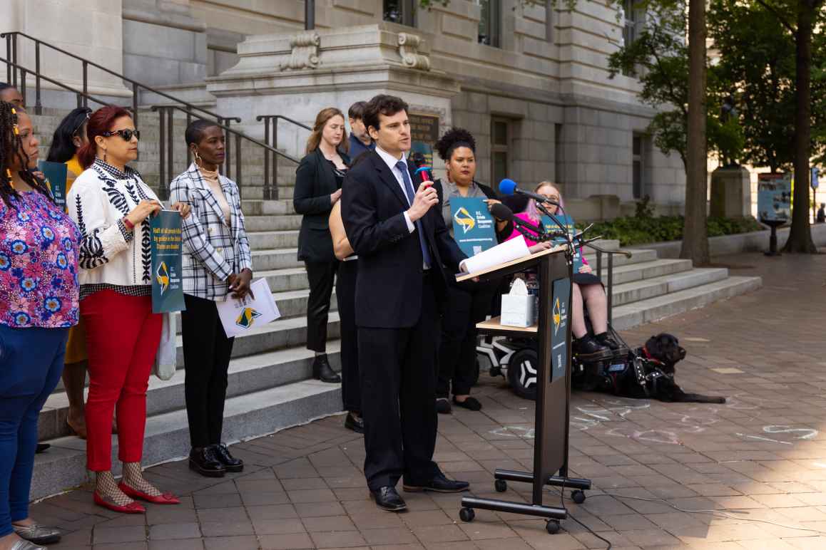 Michael Perloff speaking at the press conference for Crisis Response